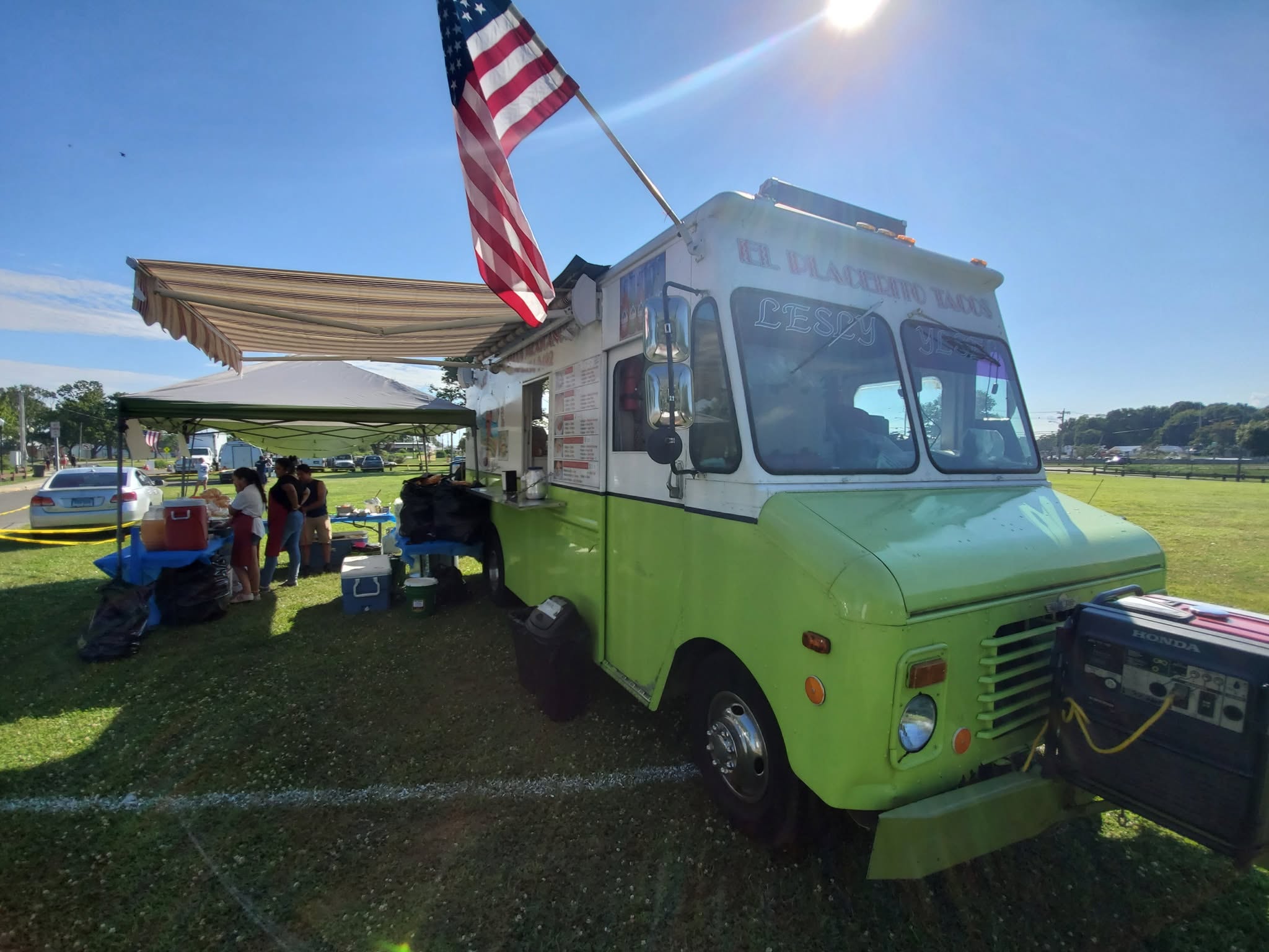 El Placerito Tacos Truck — the lime-green truck at an outdoor event in Norwalk, CT